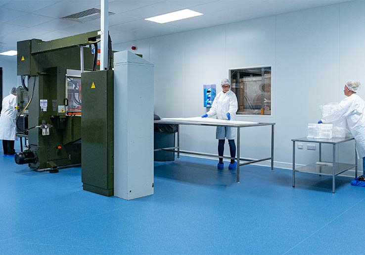 employees in cleanroom-manufacturing-room